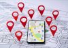 Apartment Listing Deal Gets Broken Up Smartphone with map app surrounded by red location pins