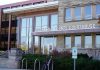 County Equity Plan Targets Beer Gardens Waukesha County Courthouse entrance with glass facade and signage