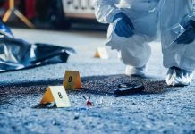 Neighbor Spots Tub – Then Horror Drops Out Forensic investigator examines a crime scene with evidence markers and a handgun