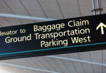 Airport Tribute Plan Takes Formal Step Airport directional sign for baggage claim and transportation