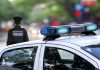 DUI Bombshell Upends Washington Race police car roof with blue emergency lights