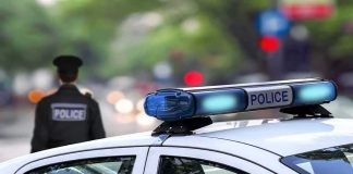 DUI Bombshell Upends Washington Race police car roof with blue emergency lights