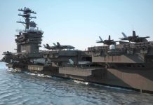 Aircraft carrier at sea with fighter jets on deck