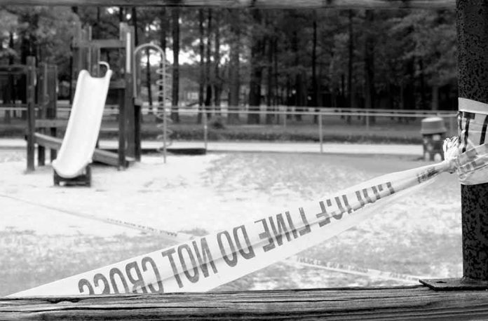 shutterstock_411555724 Playground closed off with caution tape in black and white