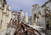 Stored Fireworks Turn Church Into Warzone Interior view of a destroyed building with collapsed arches and debris