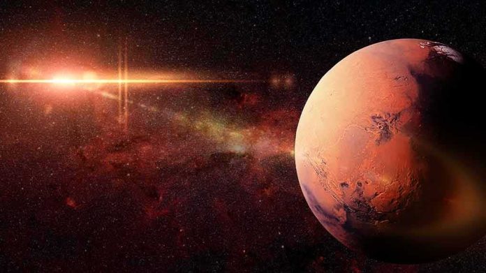 shutterstock_623413295 Mars planet with sun flare in deep space