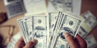 Money Changed After 2008 In A Surprising Way Hands counting US hundred-dollar bills