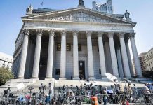 Tax Deadbeat No. 1 Lives Large In California Reporters and photographers gathered outside a neoclassical courthouse