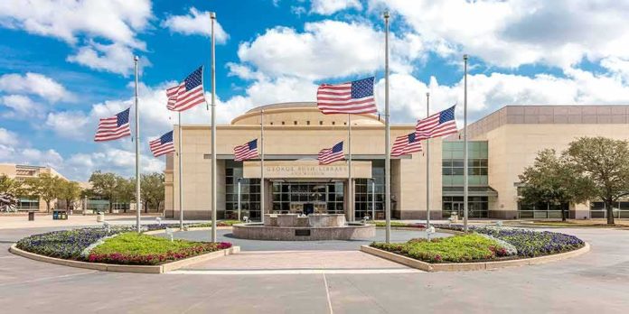 shutterstock_1090472669 American flags at half-staff around a library entrance