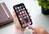Meghan Markle’s Dad – Child Sex Abuse Photos Person using a smartphone with apps on the home screen
