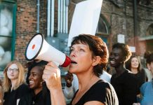Woman with megaphone leading a protest