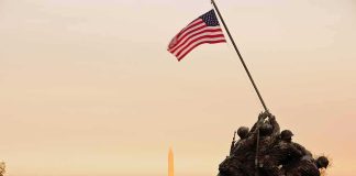 Vandal Targets Iwo Jima – Caught Mid-Swing Iwo Jima Memorial with soldiers raising the American flag at sunset