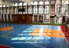 Mystery Shrouds LSU Icon’s Final Days Indoor basketball court with blue floor and orange key areas