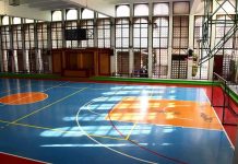 Mystery Shrouds LSU Icon’s Final Days Indoor basketball court with blue floor and orange key areas