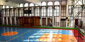 Mystery Shrouds LSU Icon’s Final Days Indoor basketball court with blue floor and orange key areas