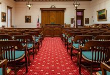 White Mediocrity Blast Triggers Investigation Courtroom with wooden benches facing the judge's bench