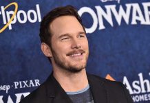 Chris Pratt smiles at a movie premiere event