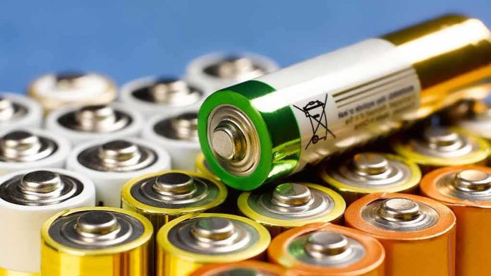 shutterstock_1711997416 Alkaline batteries stacked with one AA cell on top
