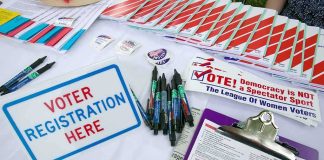 Chain-Of-Custody FAIL Exposes Glaring Blind Spot Voter registration table with forms, pens, and informational materials