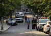 Chainsaw Horror Stuns Alabama Court Police officers secure a residential street with patrol cars and yellow tape