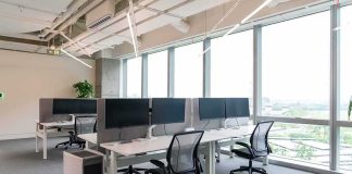 Silicon Valley Rattled: Netflix’s Ruthless Reset Modern open-plan office with workstations by large windows