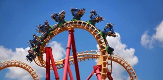 Six Flags Panic After Mid-Ride Plunge Roller coaster train twists through a vertical loop