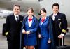Airline crew standing together on the tarmac