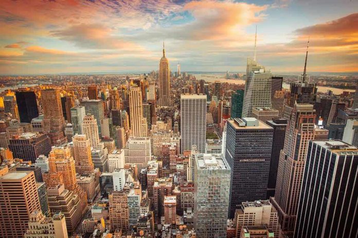 New York City skyline at sunset with tall buildings.