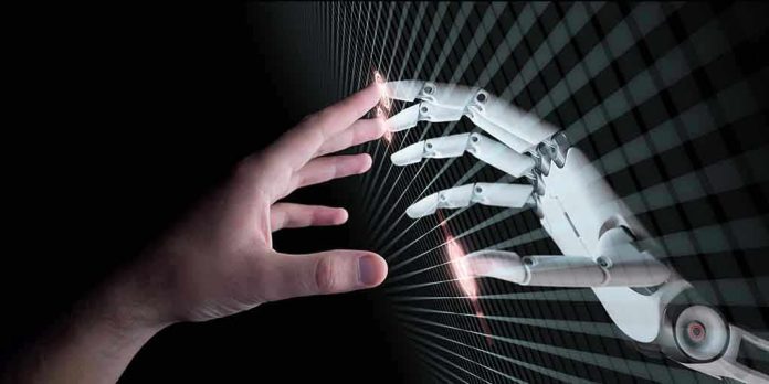 650850907 Human and robotic hand reaching out to touch