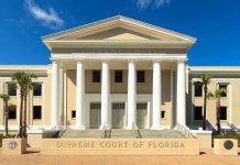 Exterior view of the Supreme Court of Florida with columns and palm trees