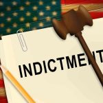 A legal document labeled INDICTMENT with a gavel and pencil