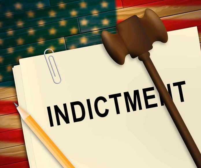 shutterstock_1435944215 (2).jpg A legal document labeled INDICTMENT with a gavel and pencil